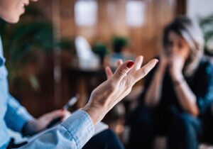 patient talks with hands in dual diagnosis treatment